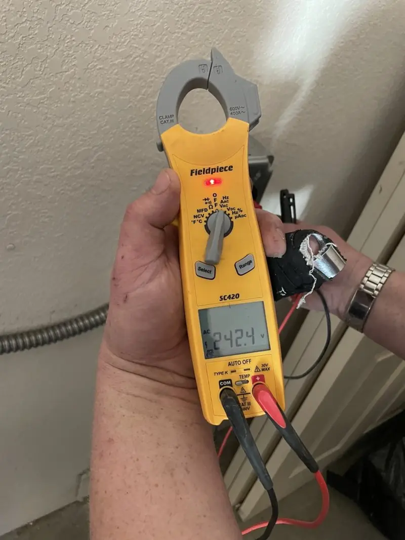 Voltage testing with clamp meter during Ceiling Fan Installation in Sumner